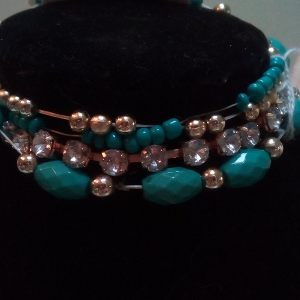 Stretchy four row bracelet turquise color